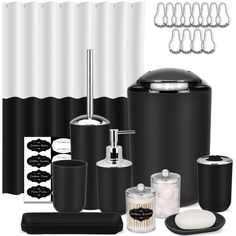 black and white bathroom accessories including soap dispenser, toothbrush holder, toiletries