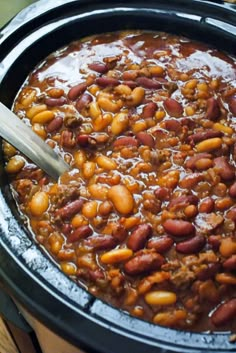 a slow cooker filled with chili and beans