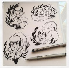 some black and white drawings on a sheet of paper