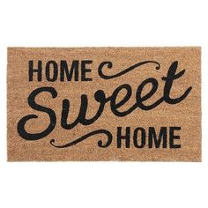 a door mat with the words home sweet home written on it in black ink, against a white background