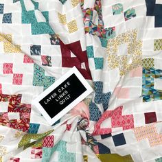 a quilt with a tag on it that says layback the little quilts quilt