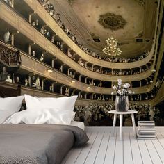 a large bed sitting in a bedroom under a ceiling