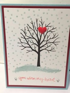 a card with a tree and heart on it