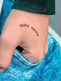 a woman's hand with the word boss nots tattooed on her left wrist