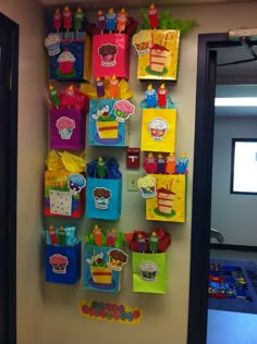 the wall is decorated with many colorful bags and magnets on it's sides