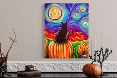 a cat sitting on top of a pumpkin in front of a night sky with stars