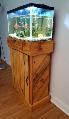 a fish tank sitting on top of a wooden cabinet