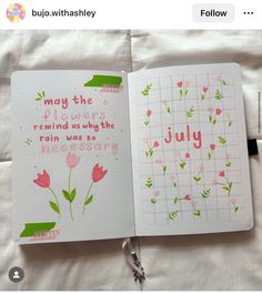 an open notebook with pink flowers and the words may the flowers remind why the rain was so necessary