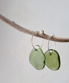 Was it a bottle, a vase, a jar? Nobody knows.  The Atlantic Ocean has worked it's magic on these beautiful fragments and recycled them into treasure!  Hand-selected and carefully-matched Green Cornish sea glass - truly unique earrings! When these pieces catch the light they are simply DAZZLING! These pieces have been oiled giving them an amazing shine. Held on Sterling Silver plated 2cm hoops. The beautiful sea glass is collected by me on Cornish beaches close to my home and lovingly recycled in Cornish Beaches, Nobody Knows, Sea Glass Earrings, Mini Hoop Earrings, Beautiful Sea, Sea Glass Necklace, Brass Charms, Statement Pendant, Beaded Hoop Earrings