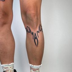 the legs and ankles of a person with tattoos on them