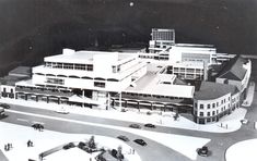 an old black and white photo of a large building