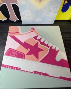 two canvass with different designs on them, one is pink and the other is white