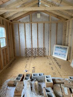 an unfinished room with wooden framing and walls