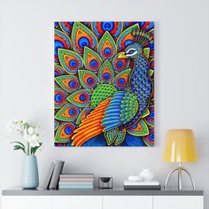 a colorful peacock painting on a white wall next to a lamp and vase with flowers