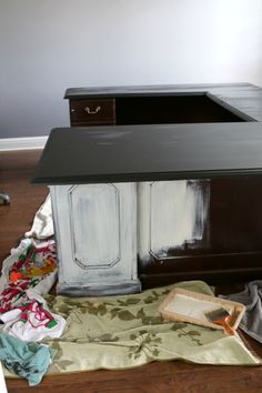 an old desk has been painted white and brown