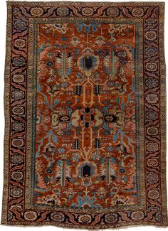 an orange and blue rug with many different designs on it's sides, including the center