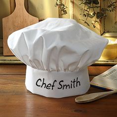 a chef hat sitting on top of a wooden table