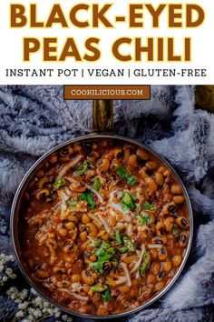 black - eyed peas chili in a pan with cheese and cilantro on the side