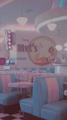 the interior of a diner with checkered flooring