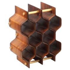 a wooden rack with six compartments and two handles on each side, made out of wood