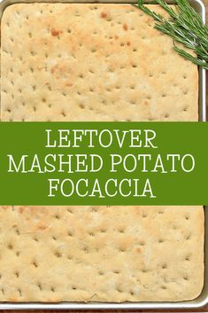 leftover mashed potato focaccia in a baking pan with rosemary sprigs