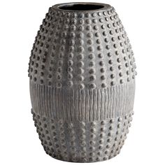 a gray vase with holes in the middle