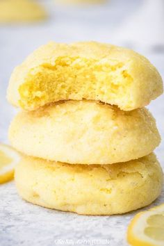 three lemon cookies stacked on top of each other with text overlay that reads, me - tawny lemon cookies