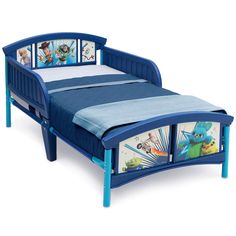 a child's bed with pictures on the headboard and foot board in blue