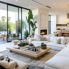 a living room filled with furniture and a fire place