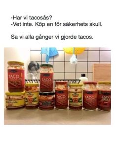 a bunch of food sitting on top of a counter in front of a tiled wall