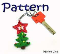 a keychain with a christmas tree on it and a star hanging from the bottom