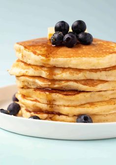 a stack of pancakes with blueberries on top