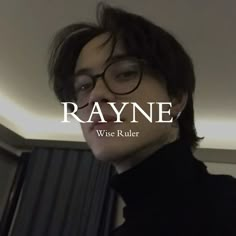 a man wearing glasses and a black turtle neck sweater with the words rayne on it