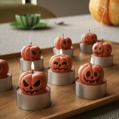 there are many candles that have been carved to look like pumpkins