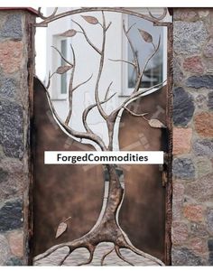 an iron door with the words forced commodities on it and a tree in front