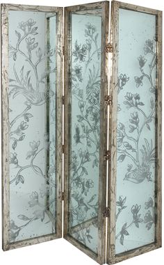 a room divider with flowers painted on the glass and silver foiled metal frame