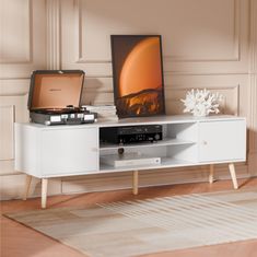 PRICES MAY VARY. Modern TV Stand for TVs up to 70"- This TV Stand with storage can accommodate most flat screen/curved TVs and hold up to 180 lbs. The assembled dimension of 61*15.7"W *20.1"H, it's recommended for TVs up to 70". Suitable for all the decor styles, adding aesthetic to your living room and bedroom Ample Storage & Adjustable Shelf- This TV console comes with 2 storage compartments with doors and 2 open space shelves, the middle shelf is adjustable with 3 different options, providing large and flexible storage capacity space Stable & Durable Construction- Made with CARB/EPA Certified Wood for sturdy structure and prolonged lifespan. The media console features rounded feet with bottom pads to avoid scratching your floor Cable Management- The entertainment center for 55+ inch tv Tv Stand Decor Bedroom, Tv Shelf Design, Wood Tv Stands, Console For Living Room, 60 Inch Tv, Tv Media Console, Entertainment Center With Storage, Tv Entertainment Center, 65 Inch Tv