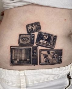 a woman's stomach with pictures of tvs and cats on it, as well as an image of a cat