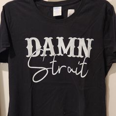 a black shirt that says damn street on it