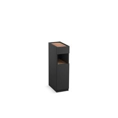 a black trash can sitting on top of a white floor next to a wooden shelf