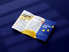 a blue and yellow brochure on a table