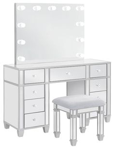 a white vanity and stool with lights on the mirror above it, in front of a white background