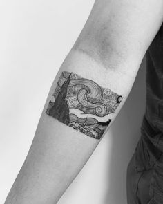 a man's arm with a black and white tattoo design on the left forearm