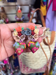 Beautiful and unique copal wood earrings. Each heart is carved and painted entirely by hand by artisans from Oaxaca. Wooden earrings in Alebrije technique, Mexican earrings, Mexican Earrings, Mexican Crafts, Painted Earrings, Traditional Earrings, Earrings Flower, Wooden Earrings, Wood Earrings, Phoenix Az, Heart Earrings