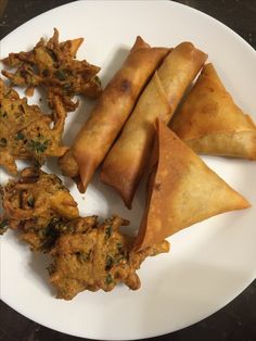 some fried food is on a white plate