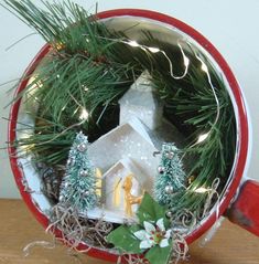 a small christmas decoration in a red and white container