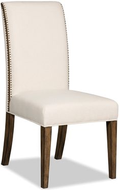 a white upholstered dining chair with wooden legs and nailhead trimmings