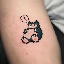 a small pixel tattoo on the arm of a person with a dice in his hand