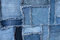 several different types of blue jeans with frayed edges and holes in the bottom half