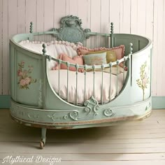 a baby's bed with pink and green decor